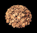 Heap of dried root pieces on a white background